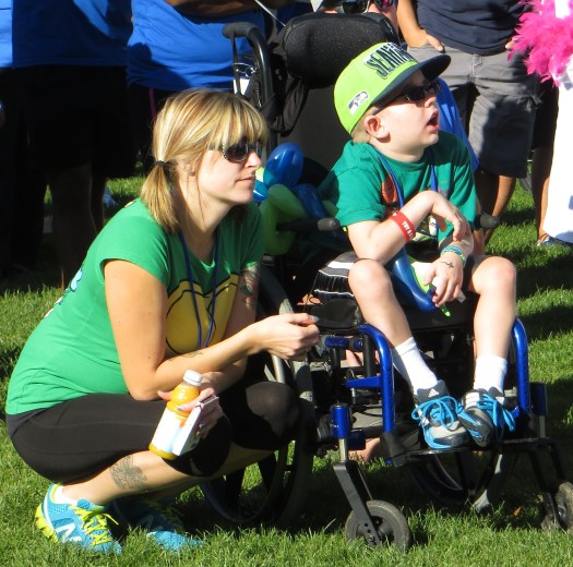 Brandy and Logan listening to an inspirational Wish Kid!